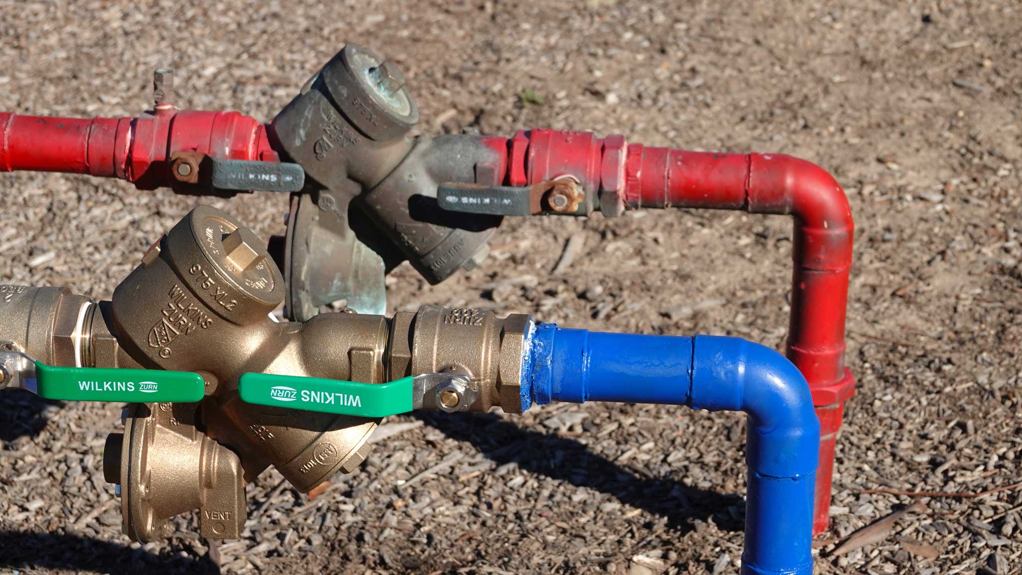 red and blue backflow pipes
